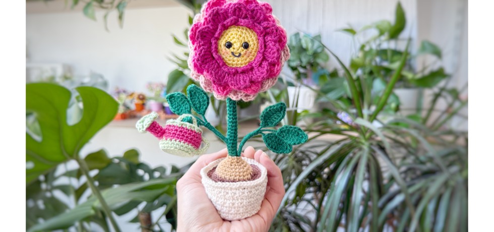 crochet dahlia in a flower pot with a watering can